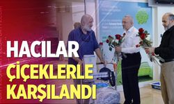 Hacılar çiçeklerle karşılandı